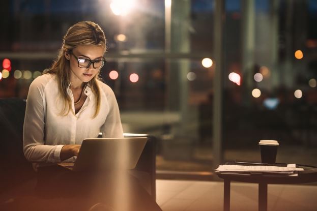 image of a working in an office at night 